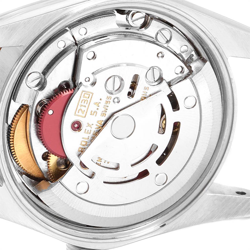 This image shows the internal mechanism of a Rolex Oyster Perpetual 67193 Women
s Steel and Gold (two tone) Champagne Dial 67193 Women
s Steel and Gold (two tone) Champagne Dial watch from a close-up angle.