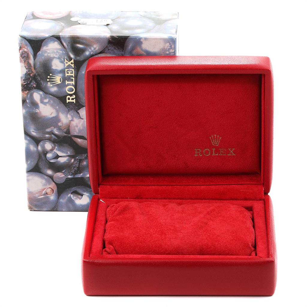 This image shows an empty, open red watch box and outer packaging for a Rolex Oyster Perpetual 67193 Women
s Steel and Gold (two tone) Champagne Dial 67193 Women
s Steel and Gold (two tone) Champagne Dial watch.