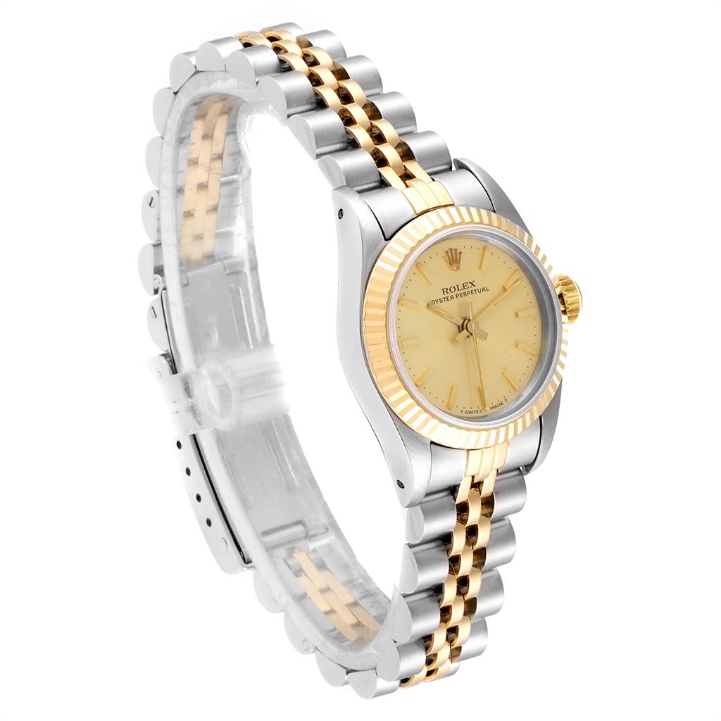 The image shows a Rolex Oyster Perpetual 67193 Women
s Steel and Gold (two tone) Champagne Dial 67193 Women
s Steel and Gold (two tone) Champagne Dial watch at a slight angle, highlighting the face, bezel, crown, and two-tone bracelet.