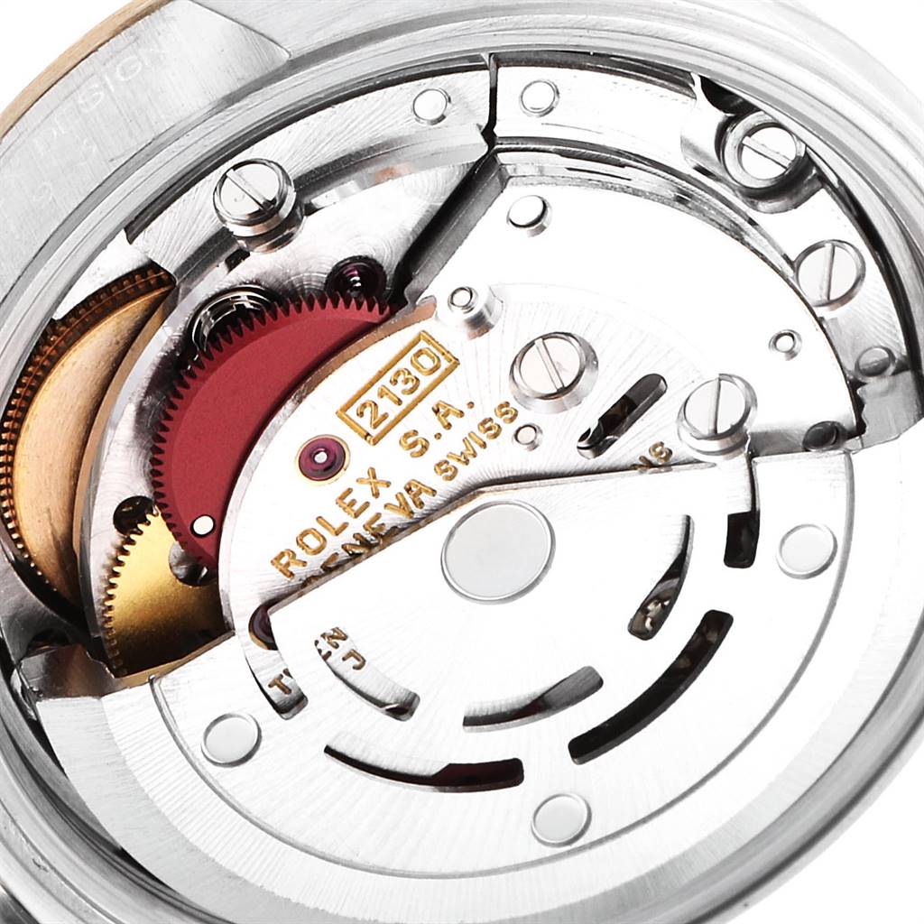 This image shows the movement and internal mechanics of a Rolex Oyster Perpetual 67193 Women
s Steel and Gold (two tone) Champagne Dial 67193 Women
s Steel and Gold (two tone) Champagne Dial watch, specifically the caliber 2130.