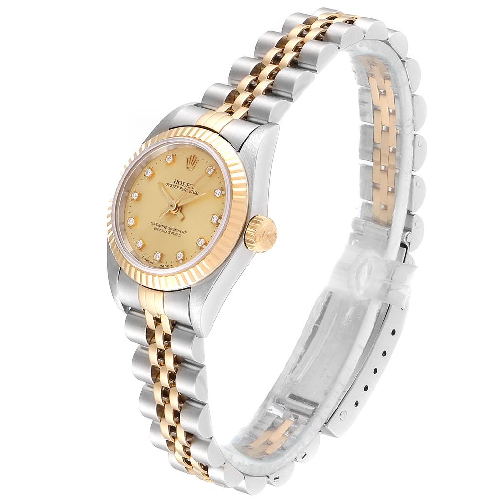 The Rolex Oyster Perpetual 67193 Women
s Steel and Gold (two tone) Champagne Dial 67193 Women
s Steel and Gold (two tone) Champagne Dial watch is shown at a three-quarter angle, highlighting its face, bezel, crown, and two-tone bracelet.