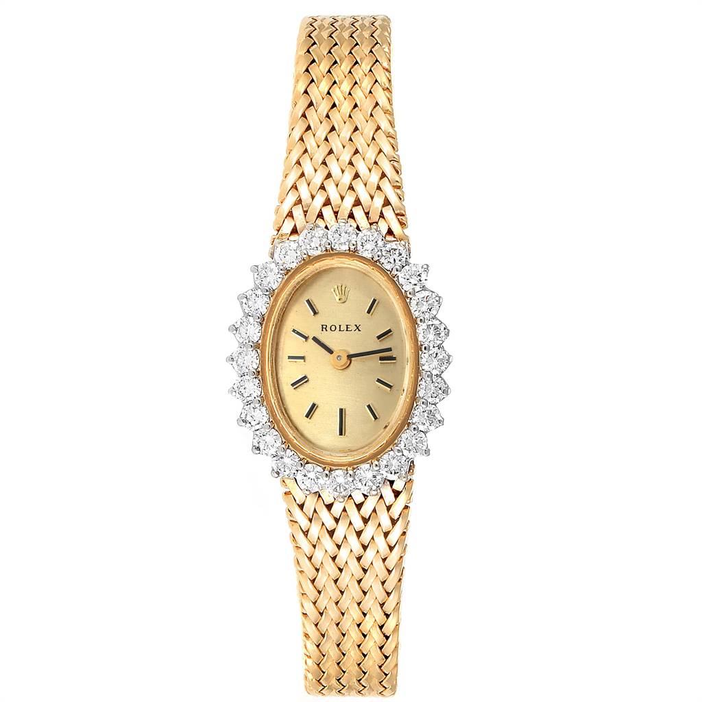 This image shows a top-down view of a Rolex Oyster Perpetual Women
s Yellow Gold Champagne Dial Women
s Yellow Gold Champagne Dial watch, featuring a woven gold band and a diamond-encrusted oval dial.