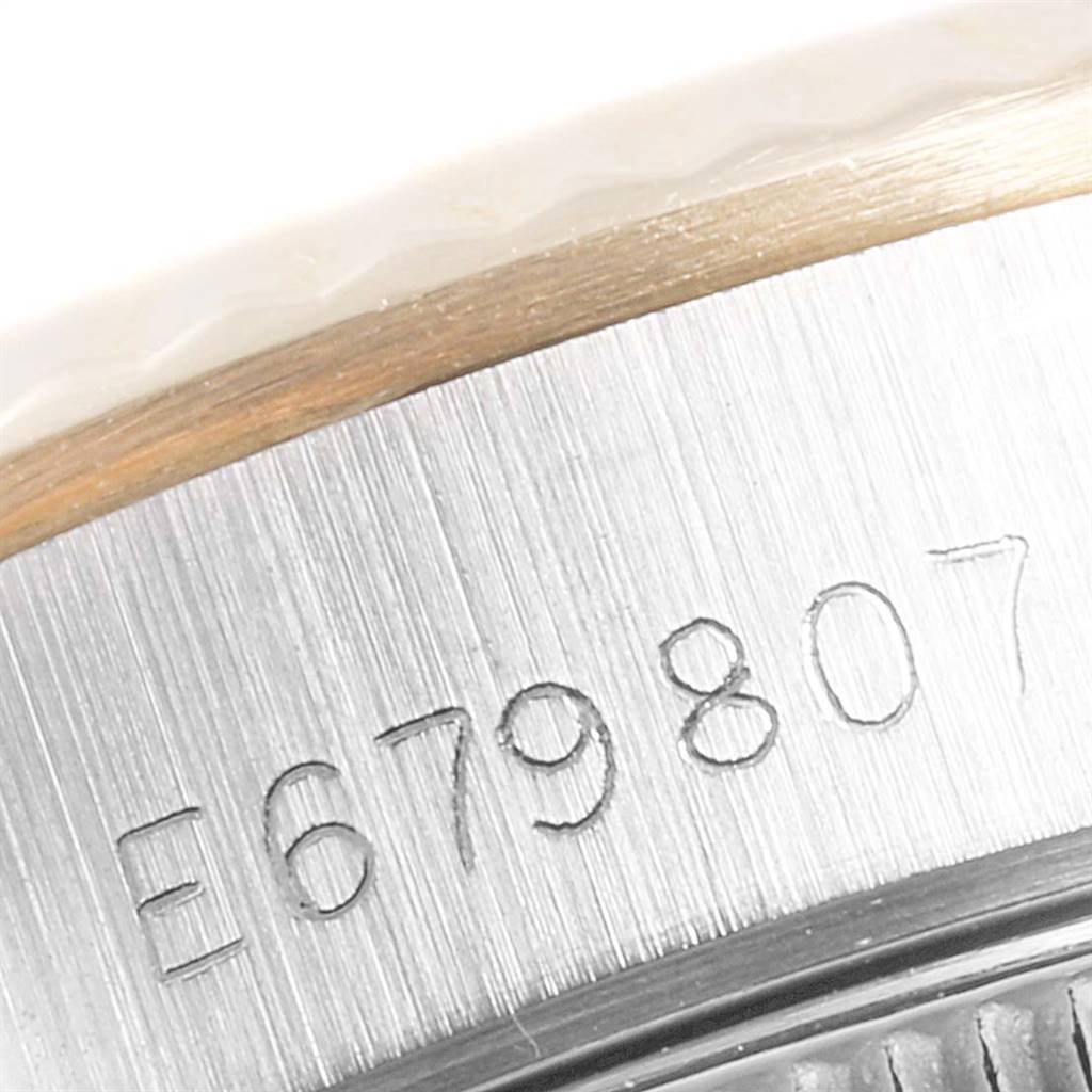 This image shows the serial number engraving on the case side of a Rolex Oyster Perpetual 67193 Women
s Steel and Gold (two tone) Champagne Dial 67193 Women
s Steel and Gold (two tone) Champagne Dial watch.