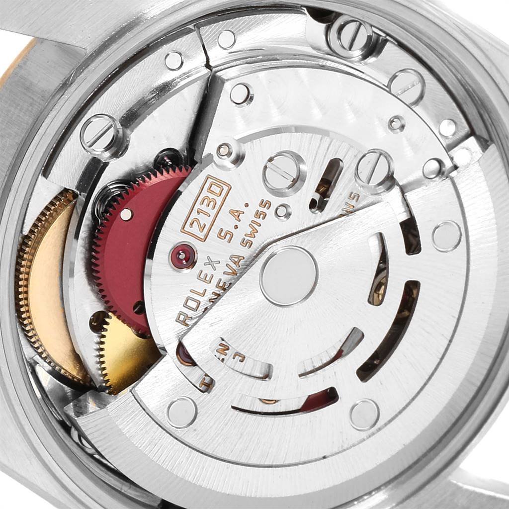 This close-up image shows the intricate internal mechanics of the Rolex Oyster Perpetual 67193 Women
s Steel and Gold (two tone) Champagne Dial 67193 Women
s Steel and Gold (two tone) Champagne Dial model.