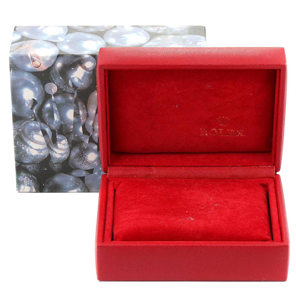 The image shows a red watch box for the Rolex Oyster Perpetual 67193 Women
s Steel and Gold (two tone) Champagne Dial 67193 Women
s Steel and Gold (two tone) Champagne Dial model, with the outer packaging visible in the background.