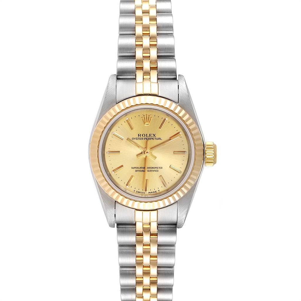 The image shows a frontal view of the Rolex Oyster Perpetual 67193 Women
s Steel and Gold (two tone) Champagne Dial 67193 Women
s Steel and Gold (two tone) Champagne Dial watch, displaying its gold and silver two-tone bracelet and fluted bezel.