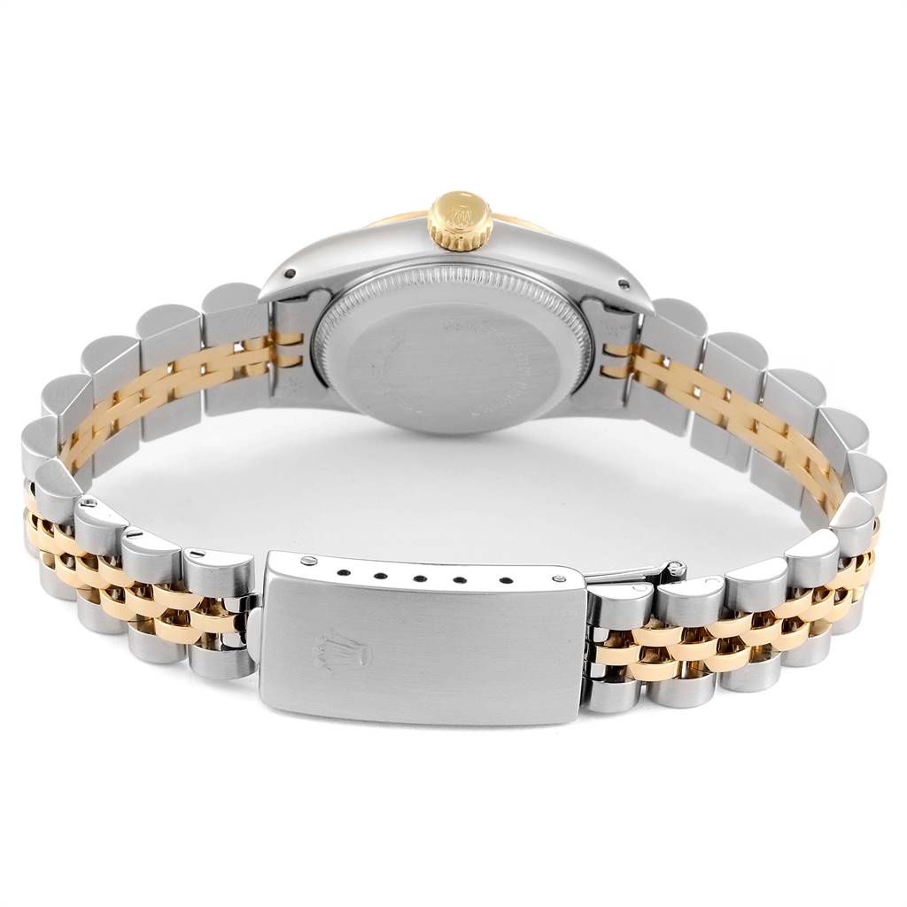 The image shows the back view of a Rolex Oyster Perpetual 67193 Women
s Steel and Gold (two tone) Champagne Dial 67193 Women
s Steel and Gold (two tone) Champagne Dial watch, highlighting the case back, crown, and bracelet.