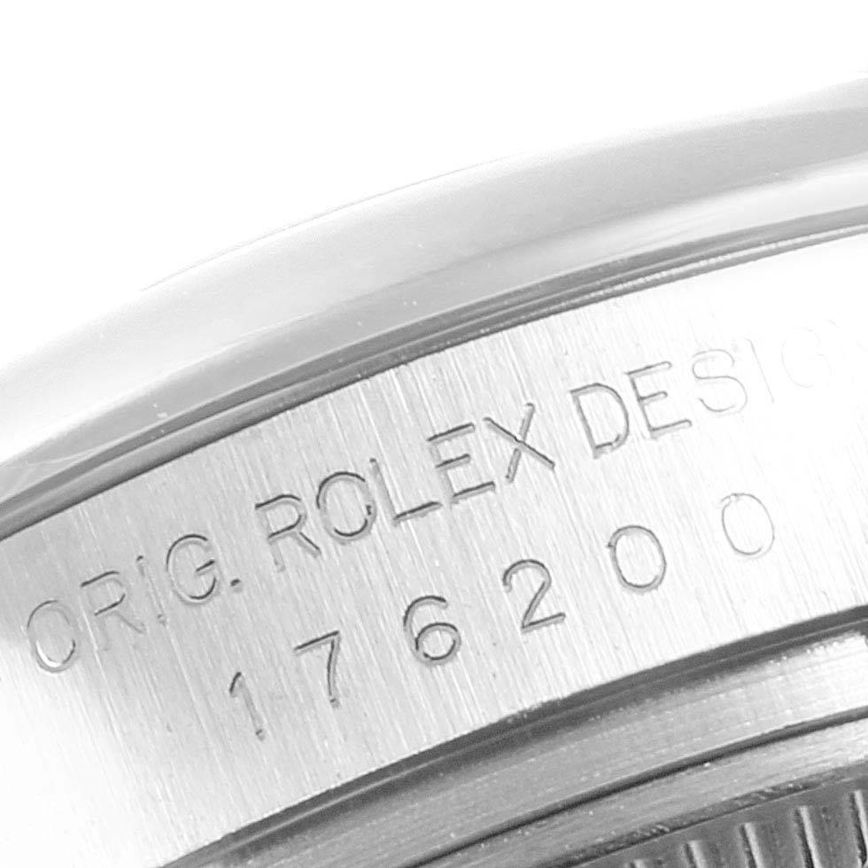 This close-up angle shows the engraved serial number and text on the Oyster Perpetual Rolex watch case.