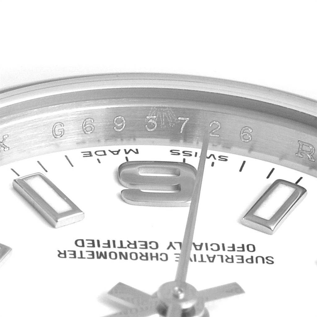 This close-up angle shows the bezel and dial of the Rolex Oyster Perpetual 176200 Women's Stainless Steel White Dial 176200 Women's Stainless Steel White Dial watch, highlighting the numbers, hands, and text.