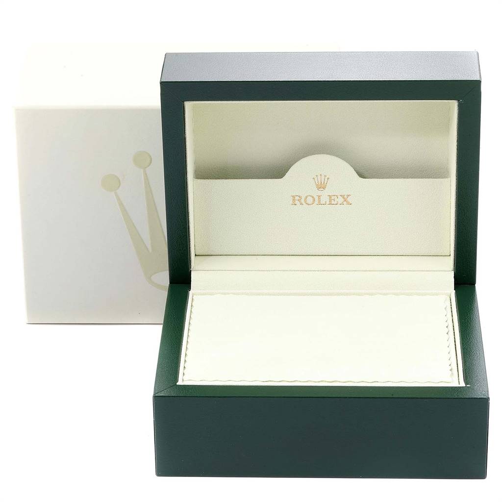 This image shows an open Rolex watch box for the Oyster Perpetual model, with the inner cushion and lid visible.