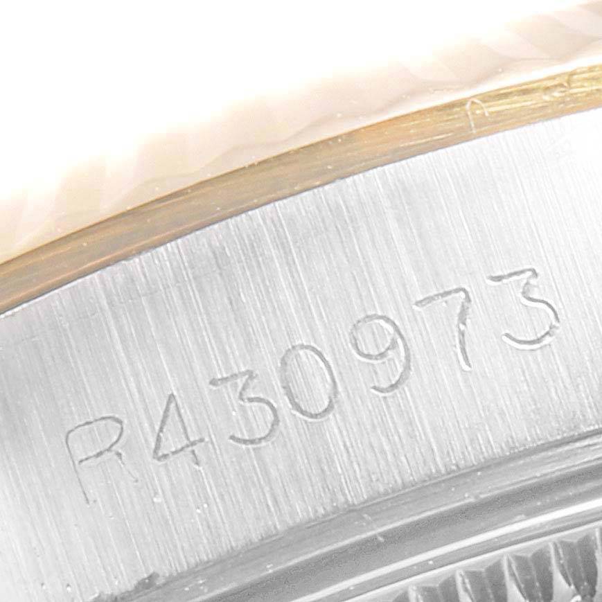 This close-up image shows the serial number engravings on the metal casing of a Rolex Oyster Perpetual 67193 Women
s Steel and Gold (two tone) Champagne Dial 67193 Women
s Steel and Gold (two tone) Champagne Dial watch.