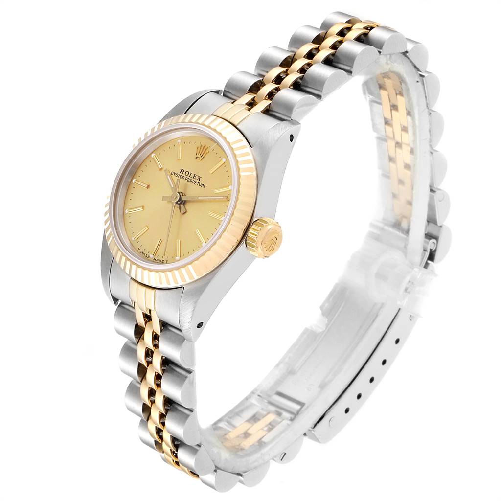 This image shows a Rolex Oyster Perpetual 67193 Women
s Steel and Gold (two tone) Champagne Dial 67193 Women
s Steel and Gold (two tone) Champagne Dial watch at an angled side view, highlighting the bezel, crown, dial, and a two-tone bracelet.