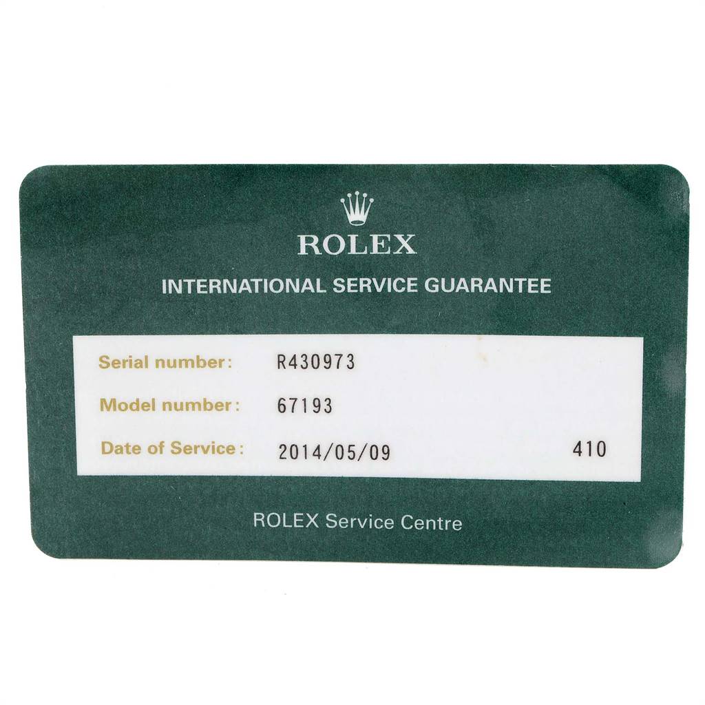 This image shows a Rolex International Service Guarantee card for an Oyster Perpetual model, detailing the serial and model number.