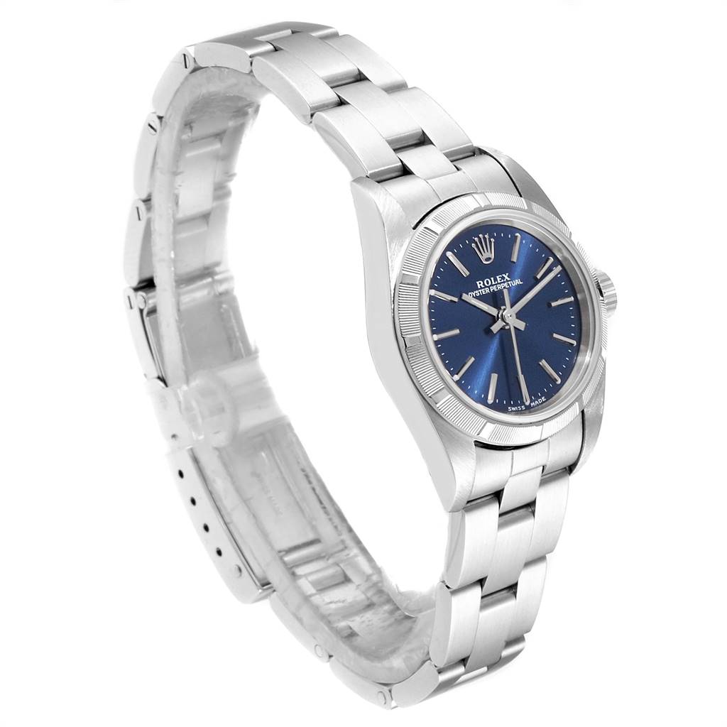 The Rolex Oyster Perpetual 76030 Women
s Stainless Steel Blue Dial 76030 Women
s Stainless Steel Blue Dial watch is shown at a three-quarter angle, highlighting the bracelet, case, bezel, and dial.