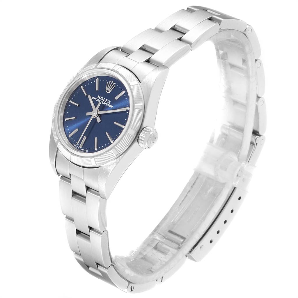 The image shows a side view of a Rolex Oyster Perpetual 76030 Women
s Stainless Steel Blue Dial 76030 Women
s Stainless Steel Blue Dial watch, showcasing its blue dial, crown, and metal bracelet.
