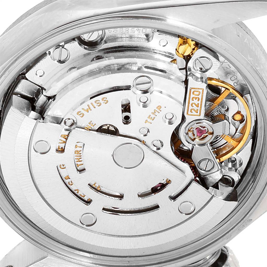 This image shows the intricate inner mechanism of a Rolex Oyster Perpetual 76094 Women's Stainless Steel Silver Dial 76094 Women's Stainless Steel Silver Dial watch, highlighting the movement components.