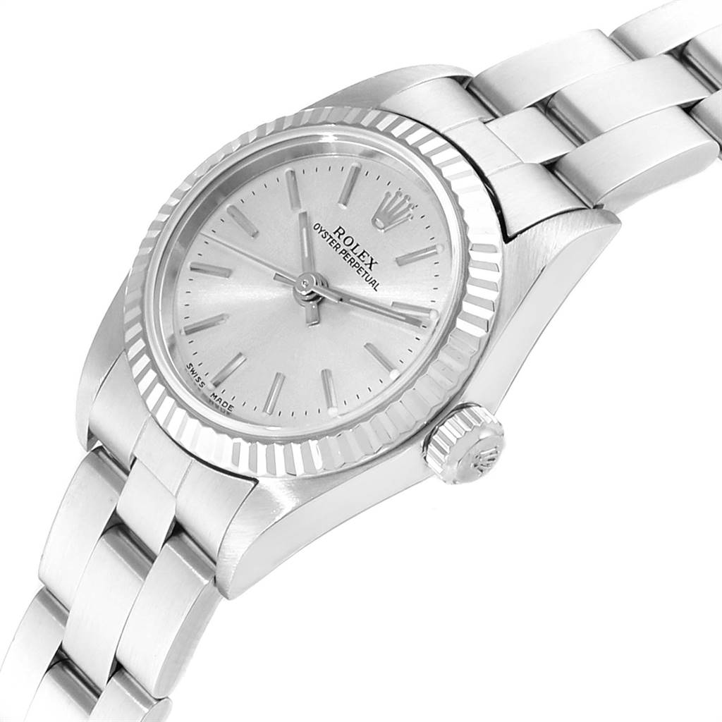 The image shows the Rolex Oyster Perpetual 76094 Women's Stainless Steel Silver Dial 76094 Women's Stainless Steel Silver Dial watch from an angled side view, highlighting its face, bezel, crown, and bracelet.