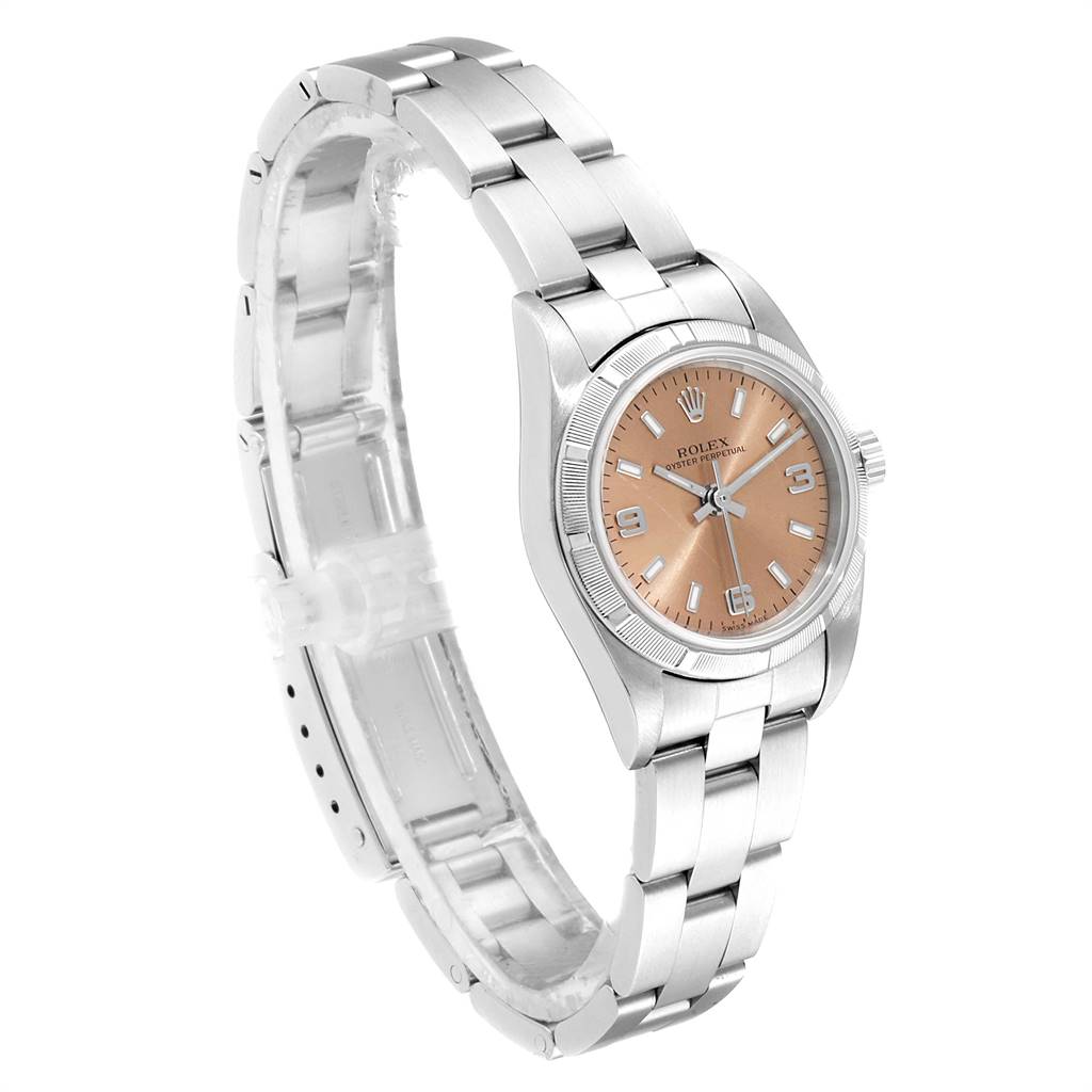 The image shows a side and partial top view of the Rolex Oyster Perpetual 76030 Women's Stainless Steel Pink Dial 76030 Women's Stainless Steel Pink Dial watch, featuring its bracelet and face.