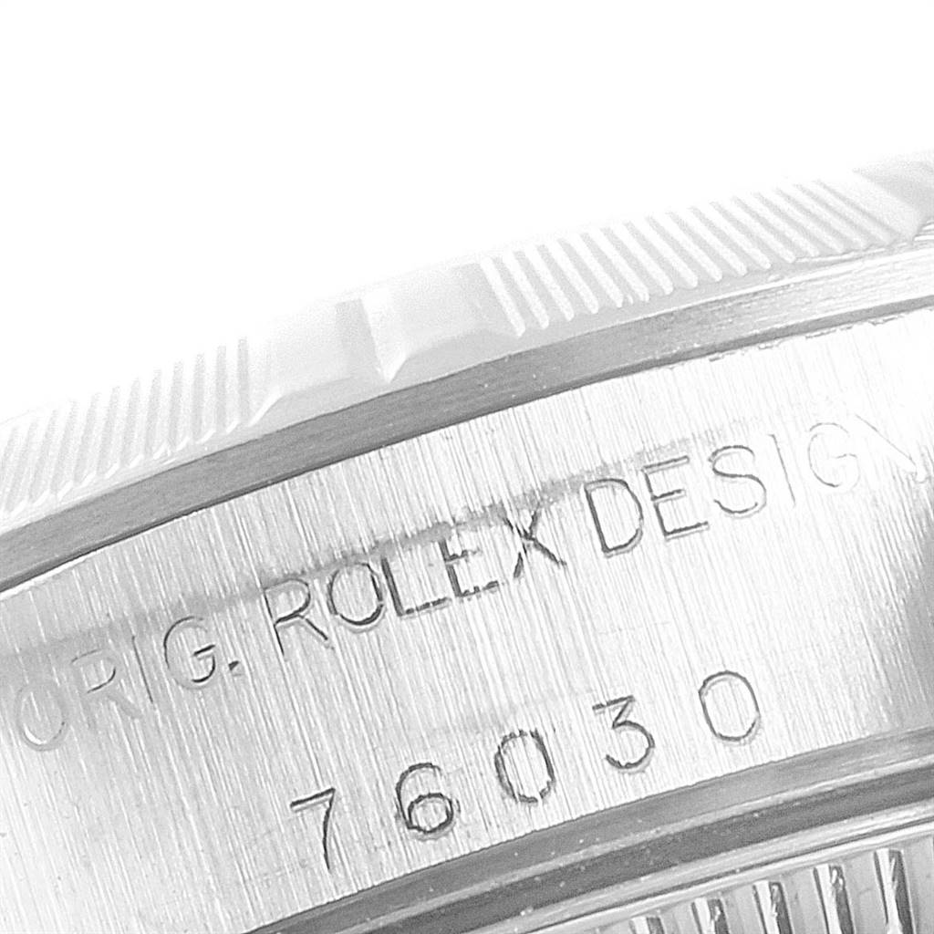 This image shows an angled close-up of the side engraving on a Rolex Oyster Perpetual 76030 Women's Stainless Steel Pink Dial 76030 Women's Stainless Steel Pink Dial watch, displaying "ORIG. ROLEX DESIGN 76030."