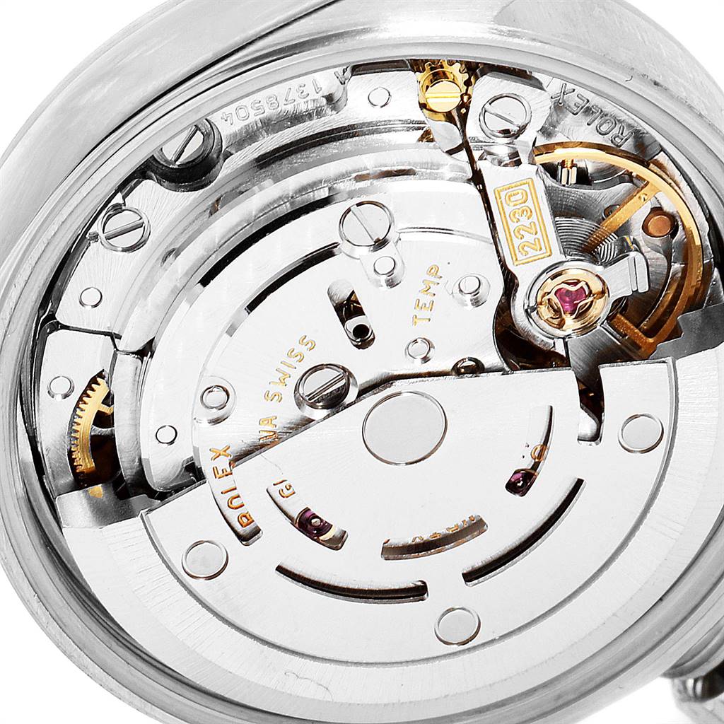 This image shows the movement and intricate internal components of a Rolex Oyster Perpetual 76030 Women's Stainless Steel Pink Dial 76030 Women's Stainless Steel Pink Dial watch from a close-up angle.