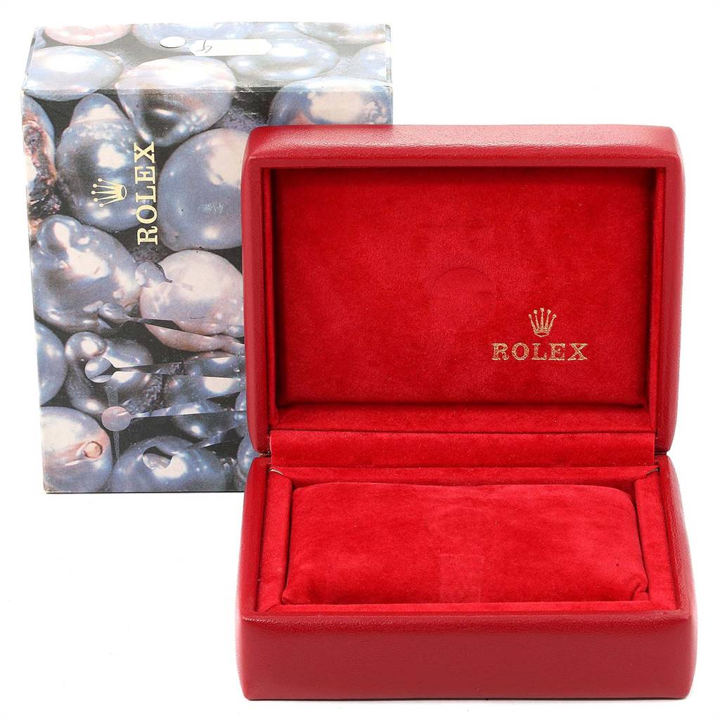 The image shows a red Rolex watch box with the lid open, labeled with the Rolex brand, without the Oyster Perpetual model watch inside.