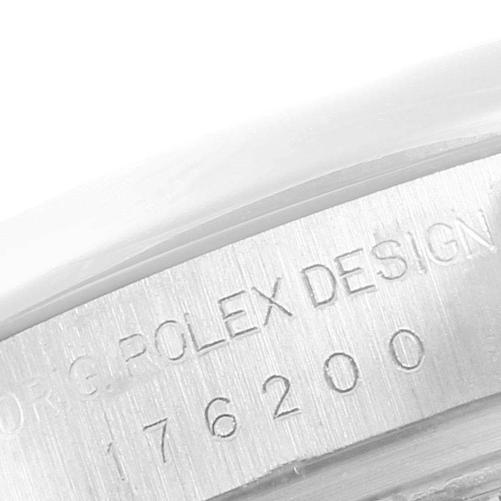This close-up image shows the engraved model number and design information on the side of a Rolex Oyster Perpetual 176200 Women's Stainless Steel Black Dial 176200 Women's Stainless Steel Black Dial watch case.