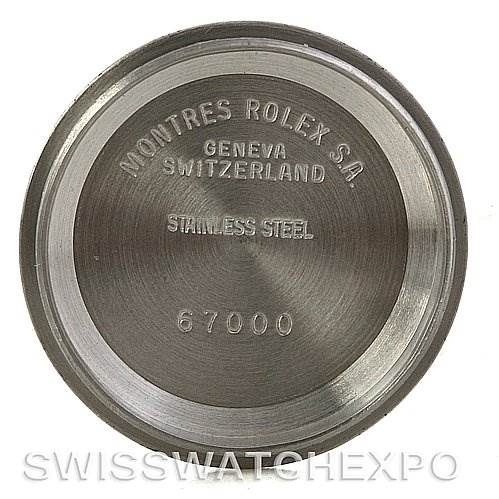 The image shows the back case of a Rolex Oyster Perpetual 67193 Women's Steel and Gold (two tone) Silver Dial 67193 Women's Steel and Gold (two tone) Silver Dial watch with engravings including the brand, model, and material.