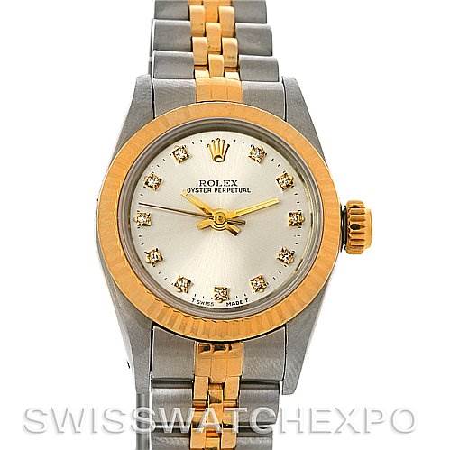The image shows a front view of the Rolex Oyster Perpetual 67193 Women's Steel and Gold (two tone) Silver Dial 67193 Women's Steel and Gold (two tone) Silver Dial watch with a silver and gold design and a diamond-studded dial.