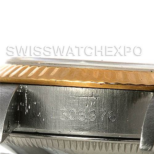 The image shows the side of the Rolex Oyster Perpetual 67193 Women's Steel and Gold (two tone) Silver Dial 67193 Women's Steel and Gold (two tone) Silver Dial watch case, focusing on the serial number engraved on the stainless steel section.
