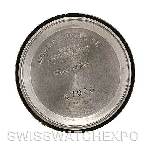 The image shows the case back of a Rolex Oyster Perpetual 67193 Women's Steel and Gold (two tone) Silver Dial 67193 Women's Steel and Gold (two tone) Silver Dial watch, engraved with model details and manufacturer's information.