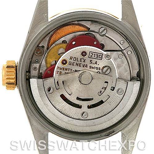 The image shows the internal mechanism and movement of a Rolex Oyster Perpetual 67193 Women's Steel and Gold (two tone) Silver Dial 67193 Women's Steel and Gold (two tone) Silver Dial watch from a back angle.