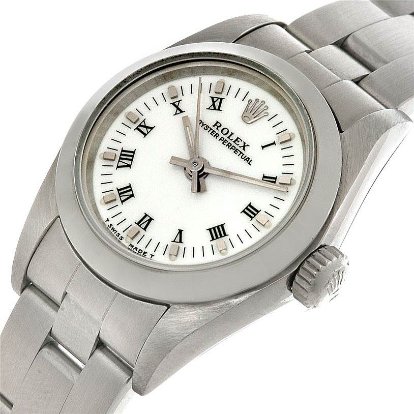 This image shows a Rolex Oyster Perpetual 67180 Women's Stainless Steel White Dial 67180 Women's Stainless Steel White Dial watch at a slight angle, displaying its face, bezel, crown, and part of the bracelet.