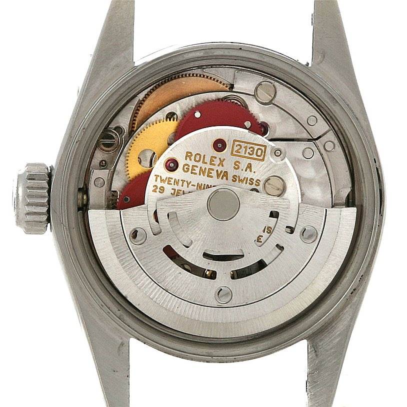 The image shows the back view of a Rolex Oyster Perpetual 67180 Women's Stainless Steel White Dial 67180 Women's Stainless Steel White Dial watch, revealing its internal mechanism and movement components.