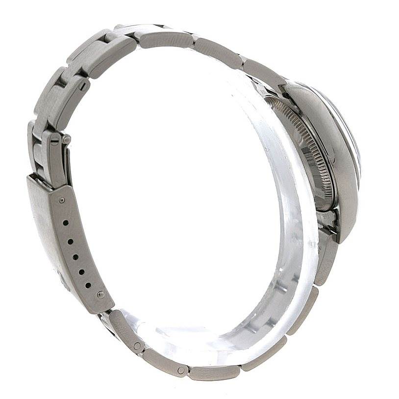 The image shows a side view of the Rolex Oyster Perpetual 67180 Women's Stainless Steel White Dial 67180 Women's Stainless Steel White Dial watch, highlighting its bracelet and side of the case.