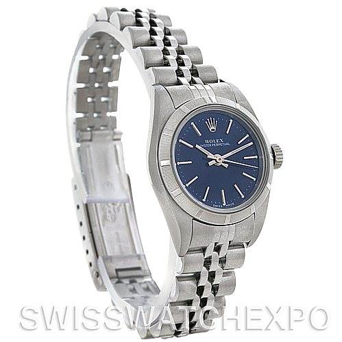 This image shows a side angle view of a Rolex Oyster Perpetual 67180 Women's Stainless Steel Blue Dial 67180 Women's Stainless Steel Blue Dial watch, highlighting its dial, bracelet, and clasp.