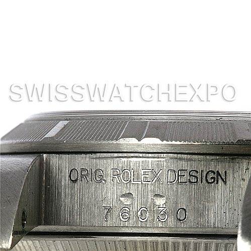 The image shows a close-up of the side of a Rolex Oyster Perpetual 67180 Women's Stainless Steel Blue Dial 67180 Women's Stainless Steel Blue Dial watch, displaying the engraved model number 76030.