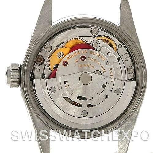 This image shows the back view of a Rolex Oyster Perpetual 67180 Women's Stainless Steel Blue Dial 67180 Women's Stainless Steel Blue Dial watch, highlighting its internal mechanism.