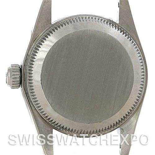 The image shows the case back and crown of a Rolex Oyster Perpetual 67180 Women's Stainless Steel Blue Dial 67180 Women's Stainless Steel Blue Dial watch from a direct rear angle.