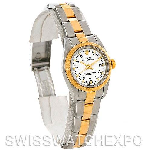 The image shows a Rolex Oyster Perpetual 76243 Women's Steel and Gold (two tone) White Dial 76243 Women's Steel and Gold (two tone) White Dial watch displaying its face, bezel, and bracelet from a three-quarter angle.