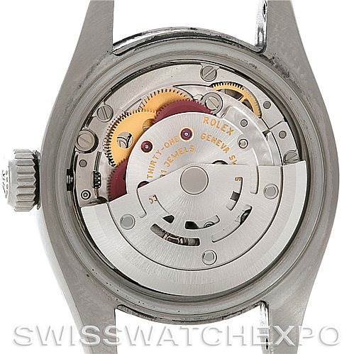 This image shows the back view of the Rolex Oyster Perpetual 176234 Women's Stainless Steel White Dial 176234 Women's Stainless Steel White Dial watch, highlighting its inner mechanical movements and rotor.