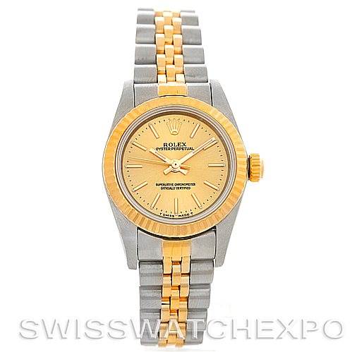 This image shows a front view of a Rolex Oyster Perpetual 67193 Women's Steel and Gold (two tone) Champagne Dial 67193 Women's Steel and Gold (two tone) Champagne Dial watch with a two-tone bracelet and gold bezel.