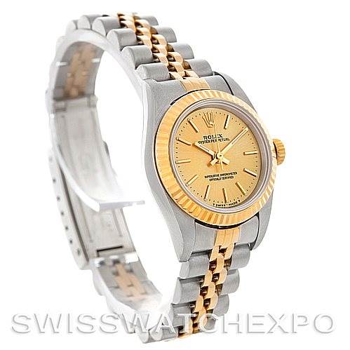 This image shows the Rolex Oyster Perpetual 67193 Women's Steel and Gold (two tone) Champagne Dial 67193 Women's Steel and Gold (two tone) Champagne Dial watch at a side angle, highlighting the dial, bezel, and two-tone bracelet.