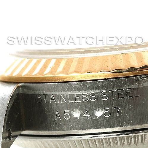 The image shows a close-up side view of the case and bezel of a Rolex Oyster Perpetual 67193 Women's Steel and Gold (two tone) Champagne Dial 67193 Women's Steel and Gold (two tone) Champagne Dial, with "STAINLESS STEEL" engraved.
