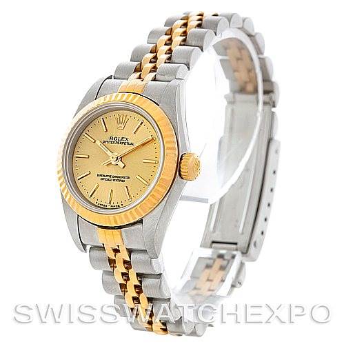 This image shows a Rolex Oyster Perpetual 67193 Women's Steel and Gold (two tone) Champagne Dial 67193 Women's Steel and Gold (two tone) Champagne Dial watch at a slight angle, highlighting its gold and silver bracelet, bezel, and dial.
