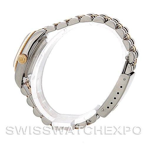 The image shows a side angle of a Rolex Oyster Perpetual 67193 Women's Steel and Gold (two tone) Champagne Dial 67193 Women's Steel and Gold (two tone) Champagne Dial watch, focusing on the bracelet and the side of the case.