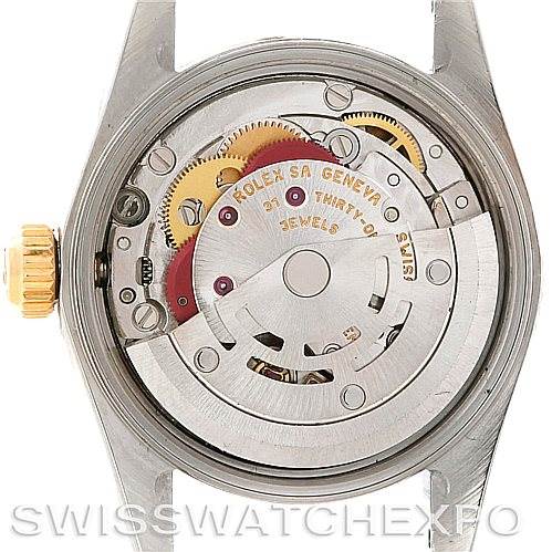 This image shows the back view of a Rolex Oyster Perpetual 67193 Women's Steel and Gold (two tone) Champagne Dial 67193 Women's Steel and Gold (two tone) Champagne Dial watch, revealing its intricate internal mechanism.