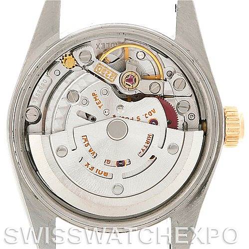 This image shows the inner mechanism of a Rolex Oyster Perpetual 76183 Women's Steel and Gold (two tone) Silver Dial 76183 Women's Steel and Gold (two tone) Silver Dial watch from a back view, focusing on the movement components.