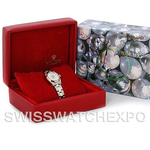 The image shows a Rolex Oyster Perpetual 76183 Women's Steel and Gold (two tone) Silver Dial 76183 Women's Steel and Gold (two tone) Silver Dial watch displayed at an angle in an open red box, with the outer packaging beside it.