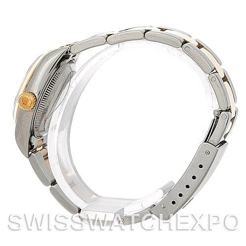 The image shows a side view of a Rolex Oyster Perpetual 76183 Women's Steel and Gold (two tone) Silver Dial 76183 Women's Steel and Gold (two tone) Silver Dial watch, prominently displaying the bracelet and the crown on the case.