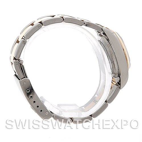 The image shows a side view of a Rolex Oyster Perpetual 76183 Women's Steel and Gold (two tone) Silver Dial 76183 Women's Steel and Gold (two tone) Silver Dial watch, highlighting the strap and the side of the case.